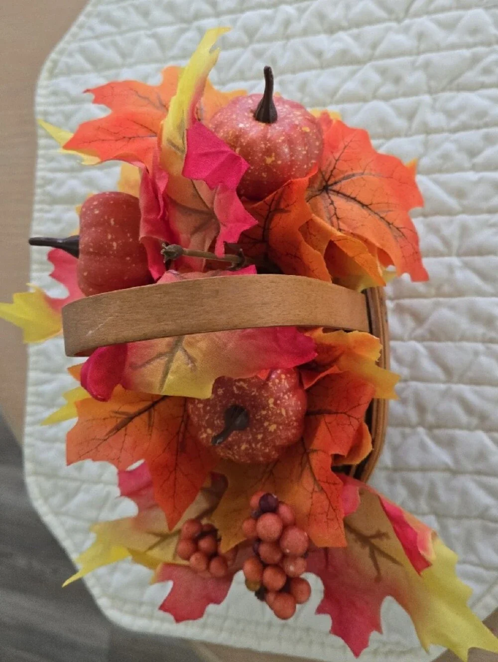 Longaberger woven basket with orange and yellow fall foliage